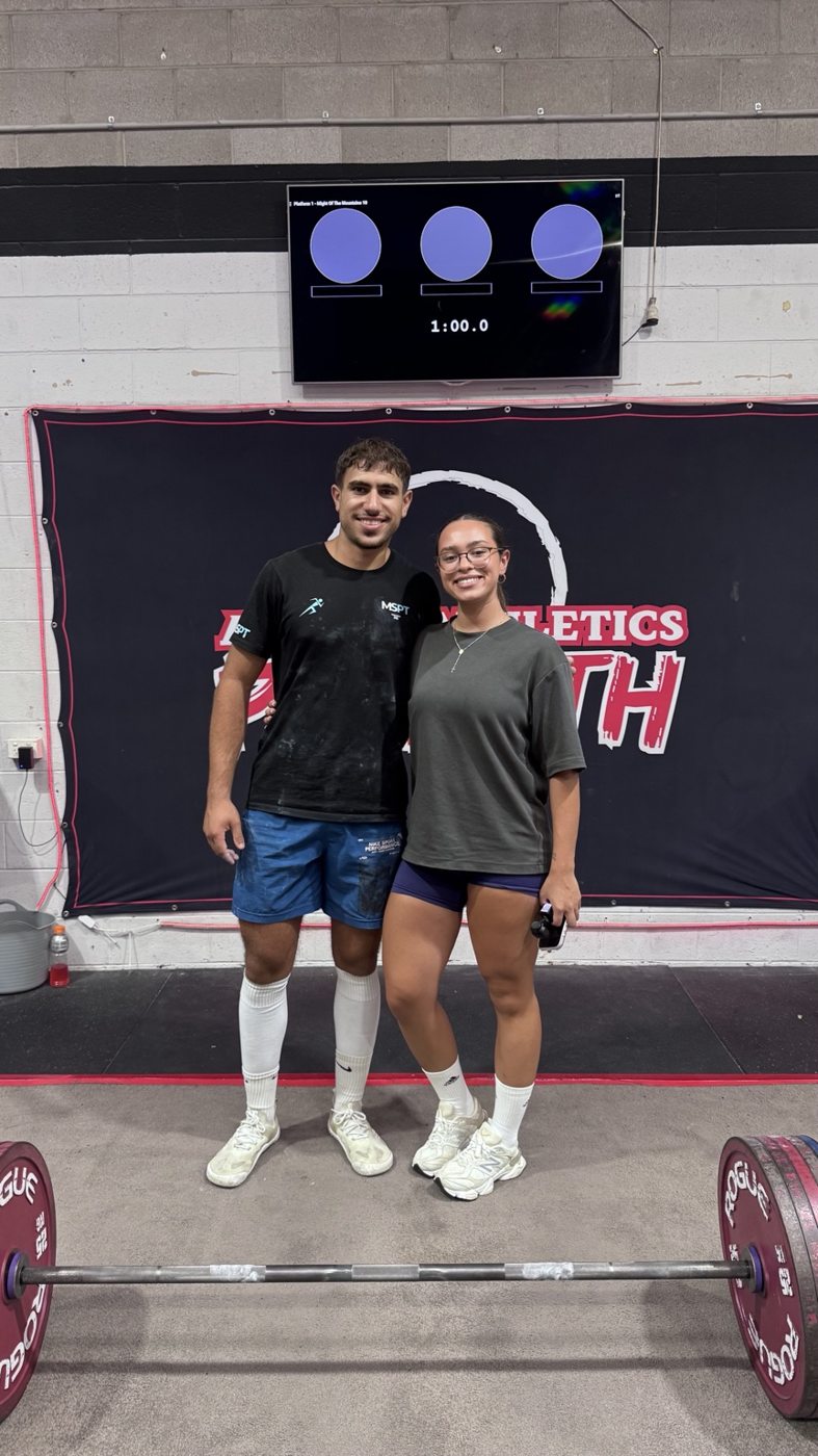 Michel and an athlete after a strength training session